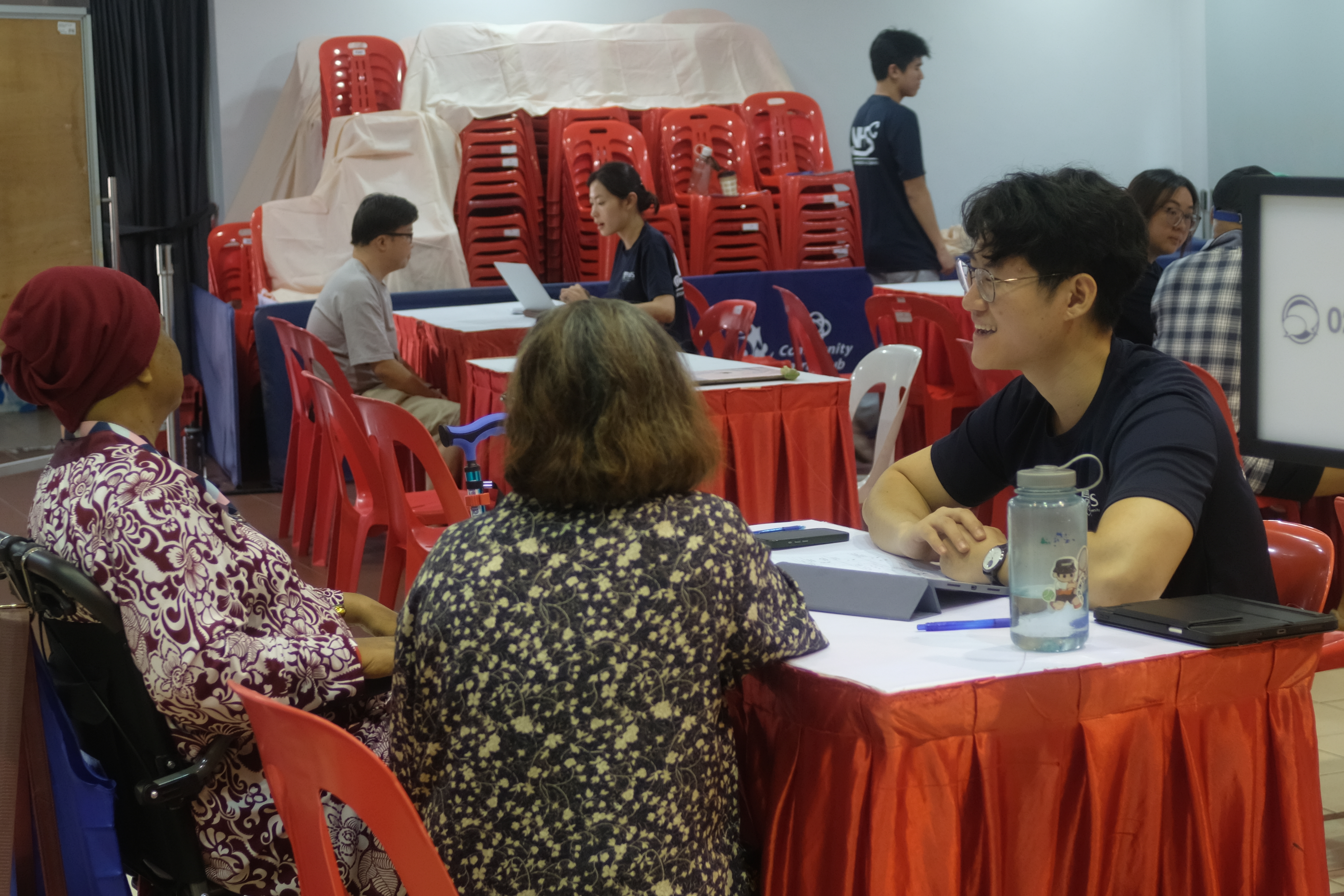 Volunteer consulting with residents